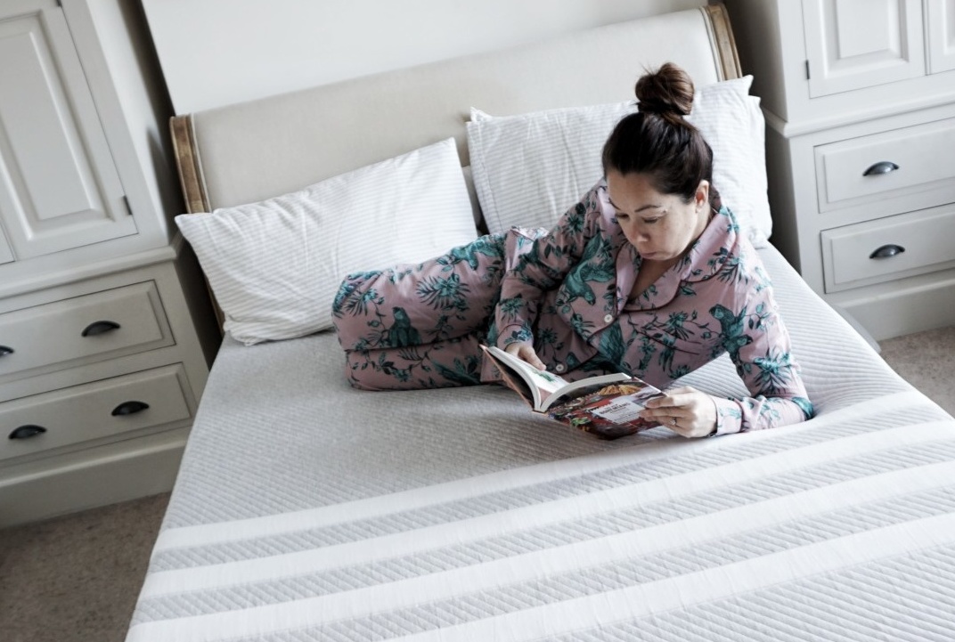 woman reading on bed